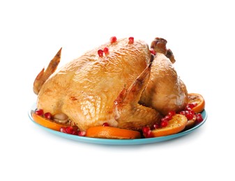 Roasted chicken with oranges and pomegranate isolated on white