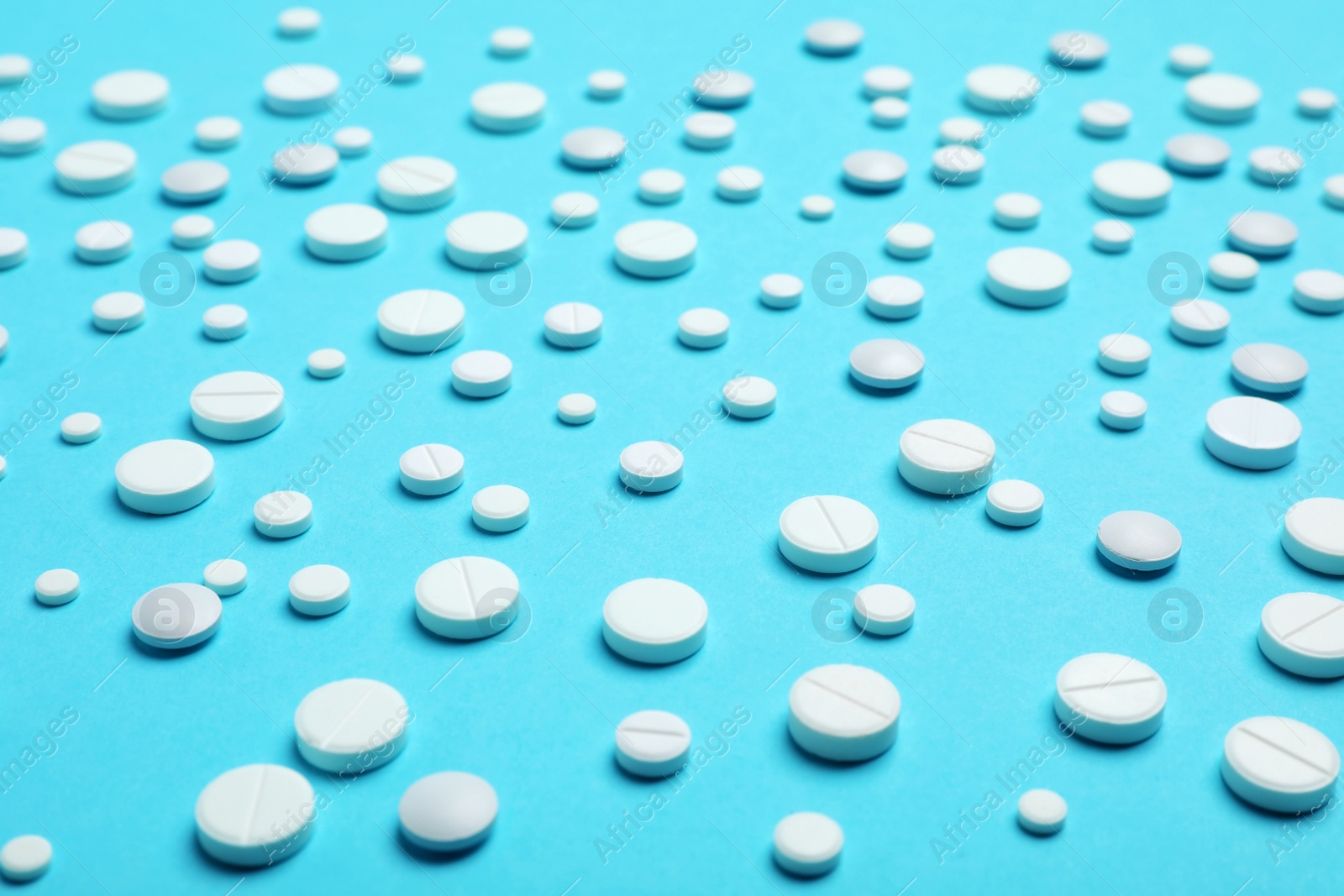 Photo of White pills on color background