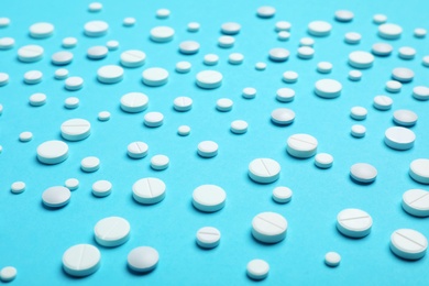 Photo of White pills on color background