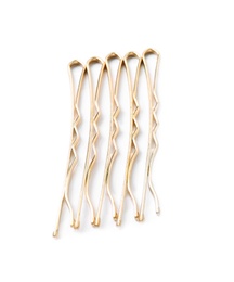 Many gold hair pins on white background, top view