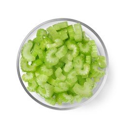 Photo of Glass bowl of fresh cut celery isolated on white, top view