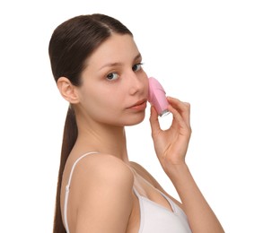 Photo of Washing face. Young woman with cleansing brush on white background