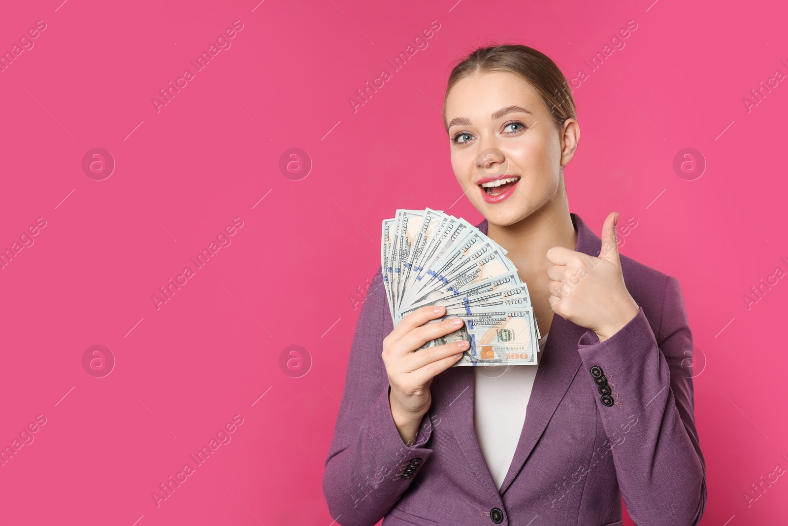 Photo of Portrait of happy young businesswoman with money on color background. Space for text