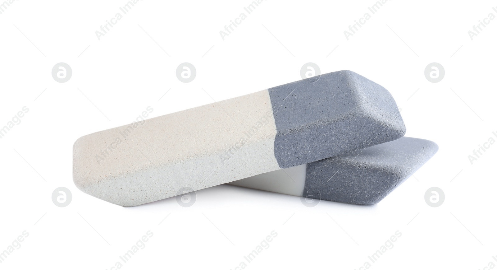 Photo of New double erasers isolated on white. School stationery