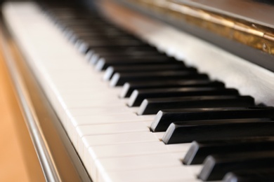 Black and white piano keys indoors, closeup