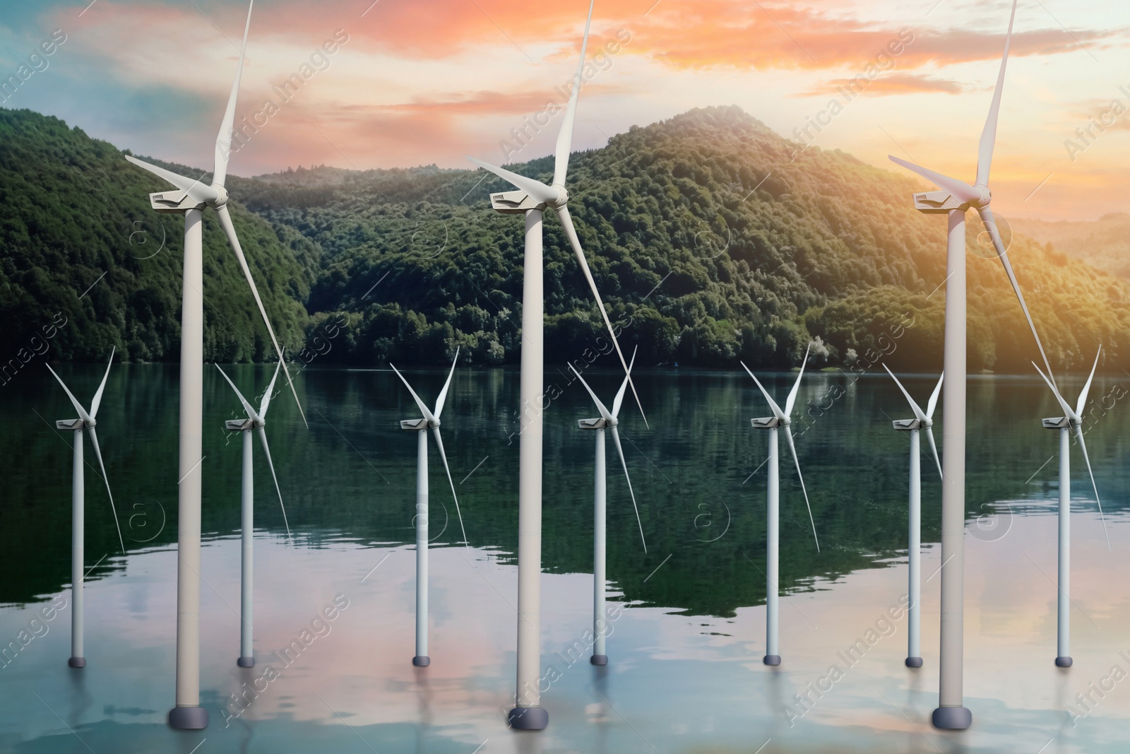 Image of Floating wind turbines installed in water near mountains. Alternative energy source