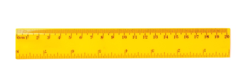 Photo of Colorful plastic ruler on white background. School stationery