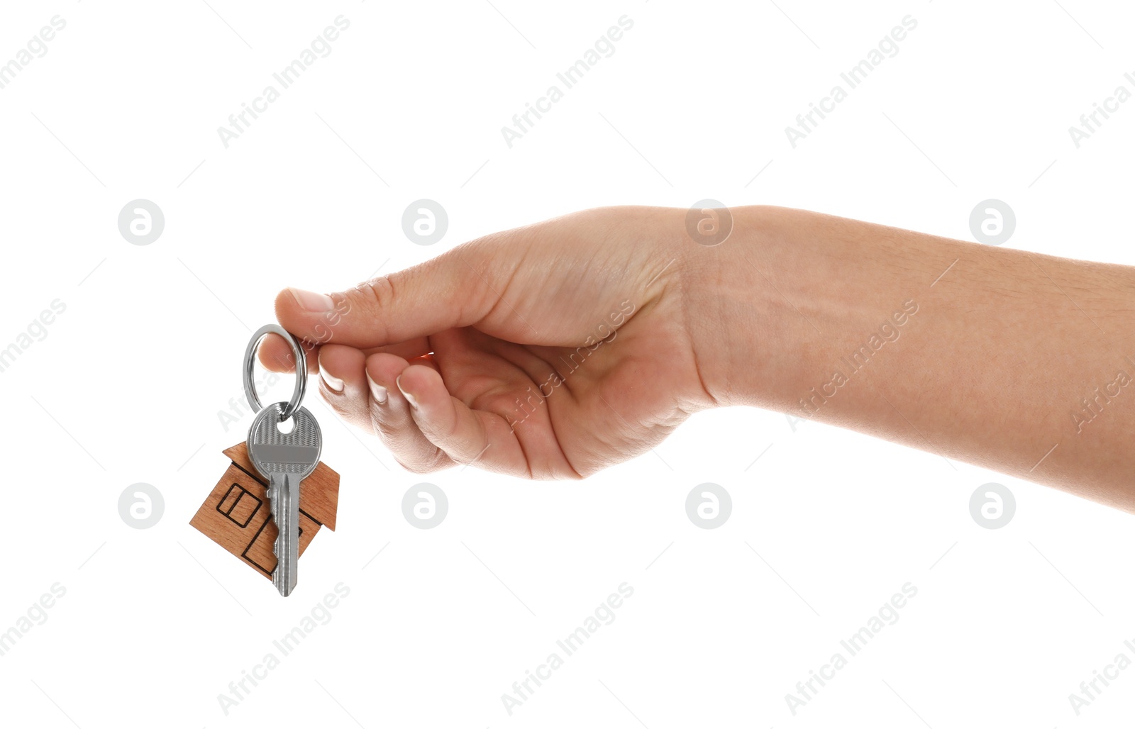 Photo of Real estate agent holding house key with trinket on white background, closeup