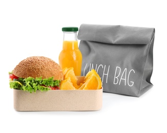 Photo of Lunch box with appetizing food, bottle of juice and bag on white background