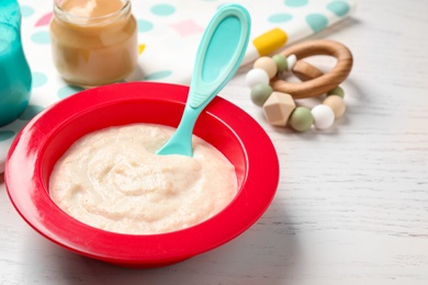 Healthy baby food on white wooden table, closeup