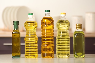 Bottles of oils on table against blurred background