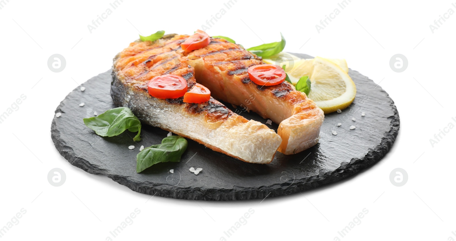 Photo of Slate plate with tasty salmon steak on white background