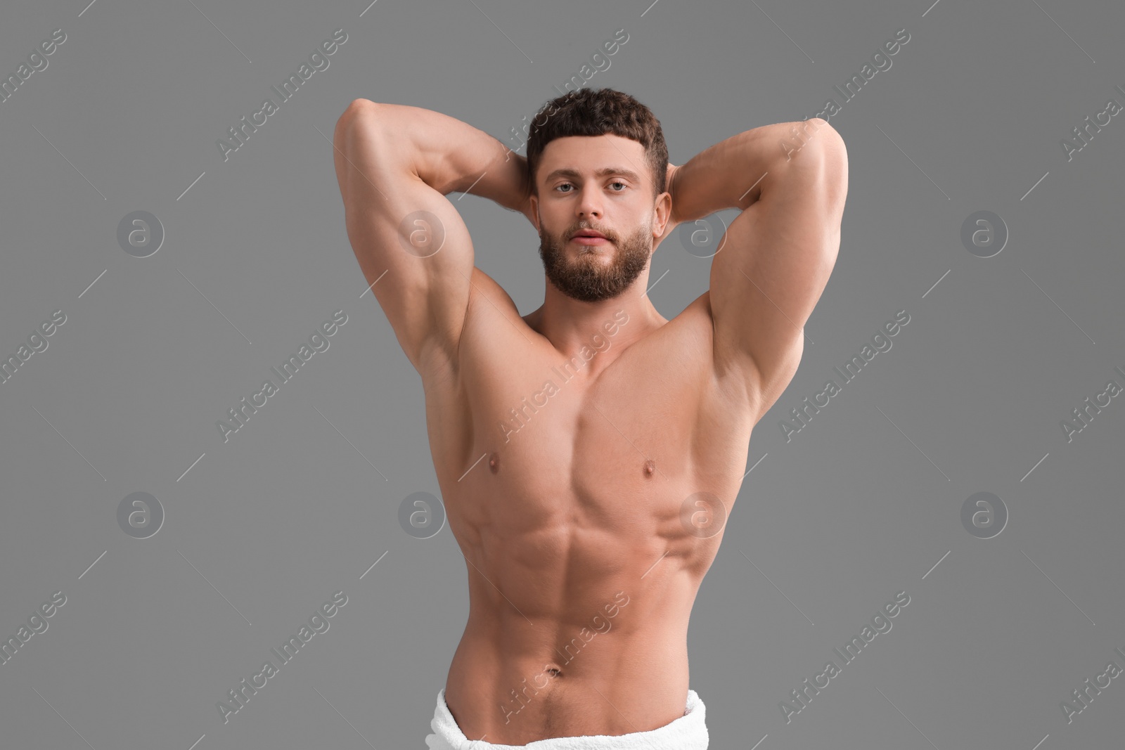 Photo of Handsome muscular man on grey background. Sexy body