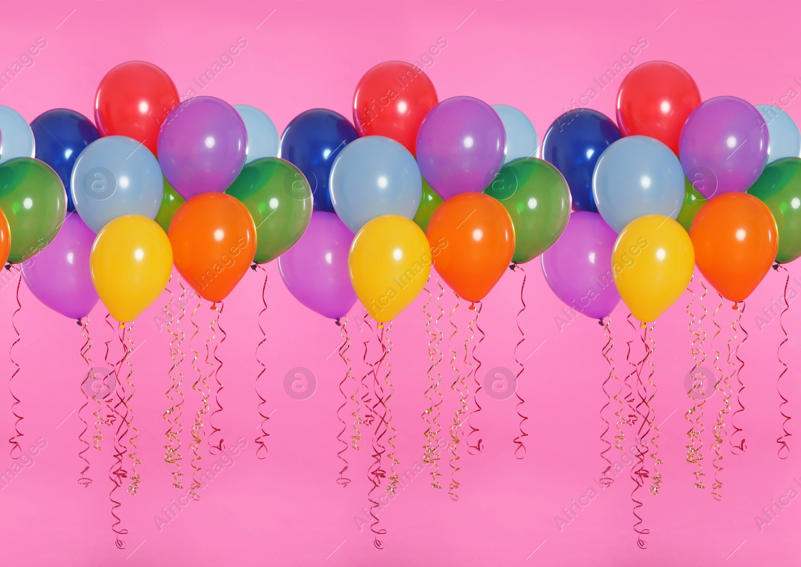 Image of Many color balloons on pink background. Festive decor