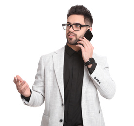 Photo of Young businessman talking on smartphone against white background