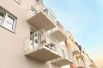 Exterior of beautiful building with balconies, low angle view