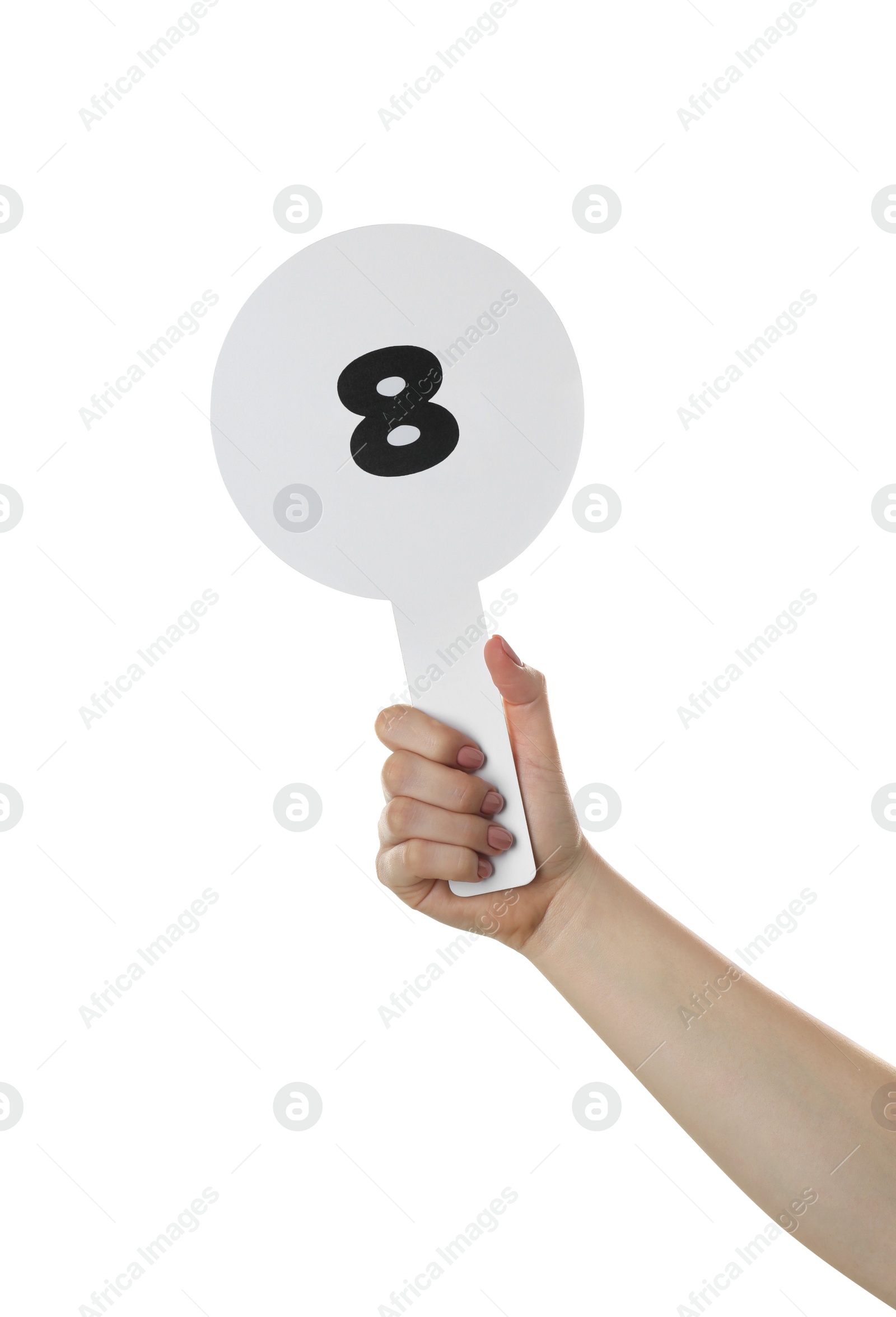Photo of Woman holding auction paddle with number 8 on white background, closeup