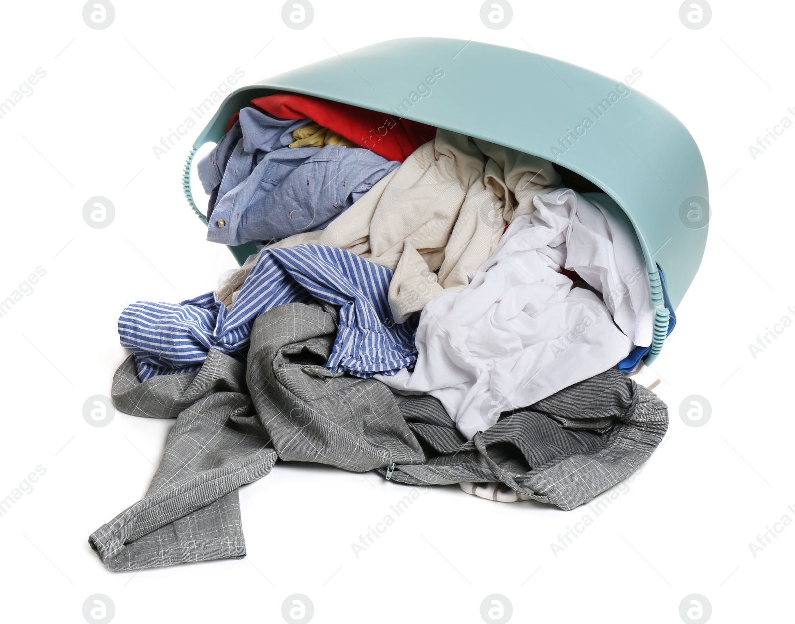 Photo of Overturned laundry basket full of clothes isolated on white