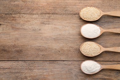 Spoons with quinoa flour and seeds on wooden table, flat lay. Space for text