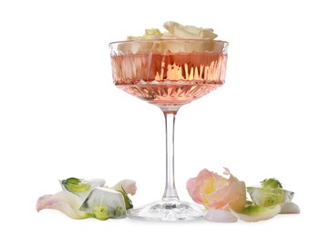Photo of Glass with tasty wine, rose petals and ice cubes on white background