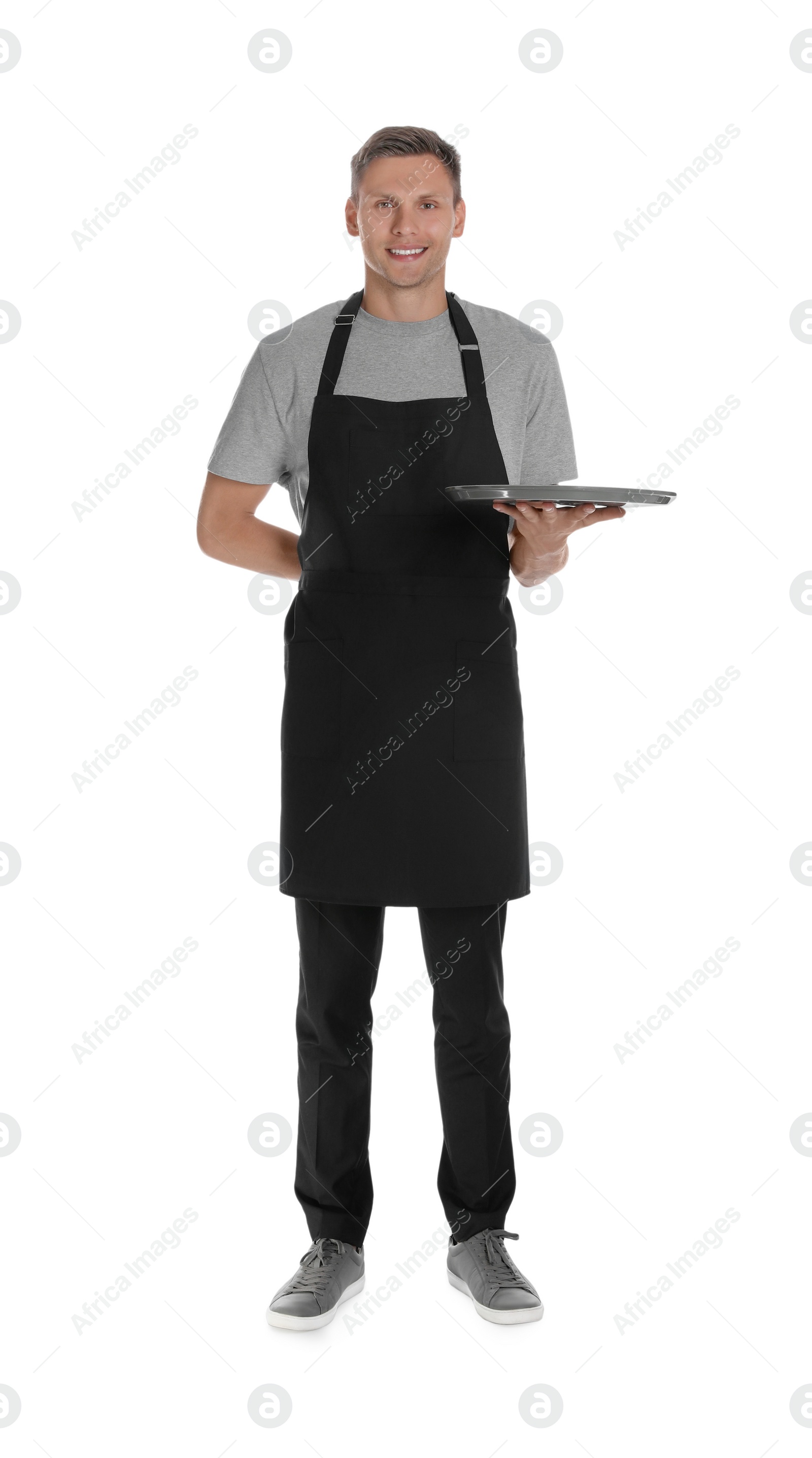 Photo of Full length portrait of happy young waiter with tray on white background