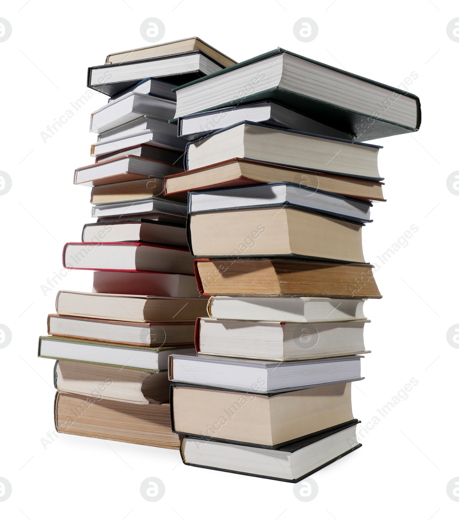 Photo of Stacks of many different books isolated on white