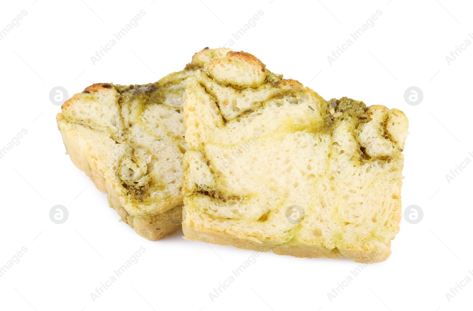 Photo of Slices of freshly baked pesto bread isolated on white