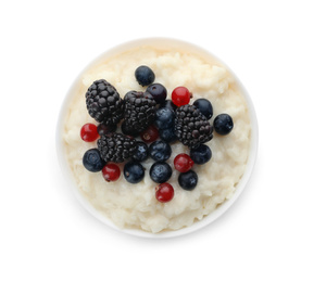 Photo of Delicious rice pudding with berries isolated on white, top view