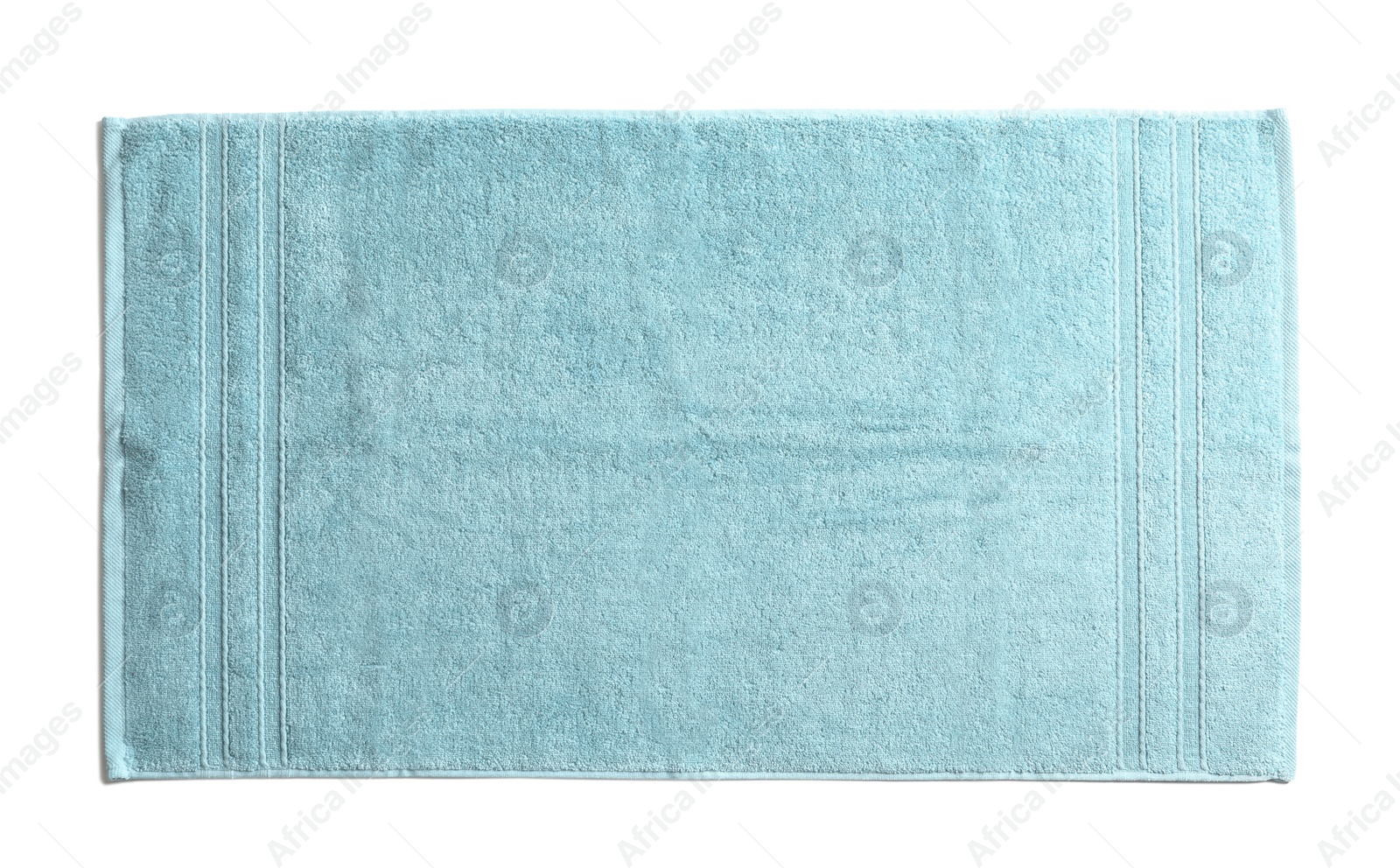 Photo of Clean soft terry towel on white background, top view