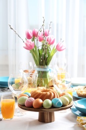 Festive Easter table setting with traditional meal at home