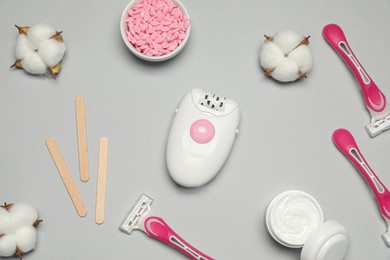 Flat lay composition with different epilation products on light grey background