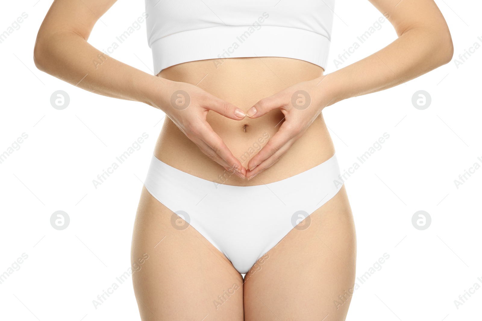 Photo of Gynecology. Woman in underwear making heart with her hands on white background, closeup