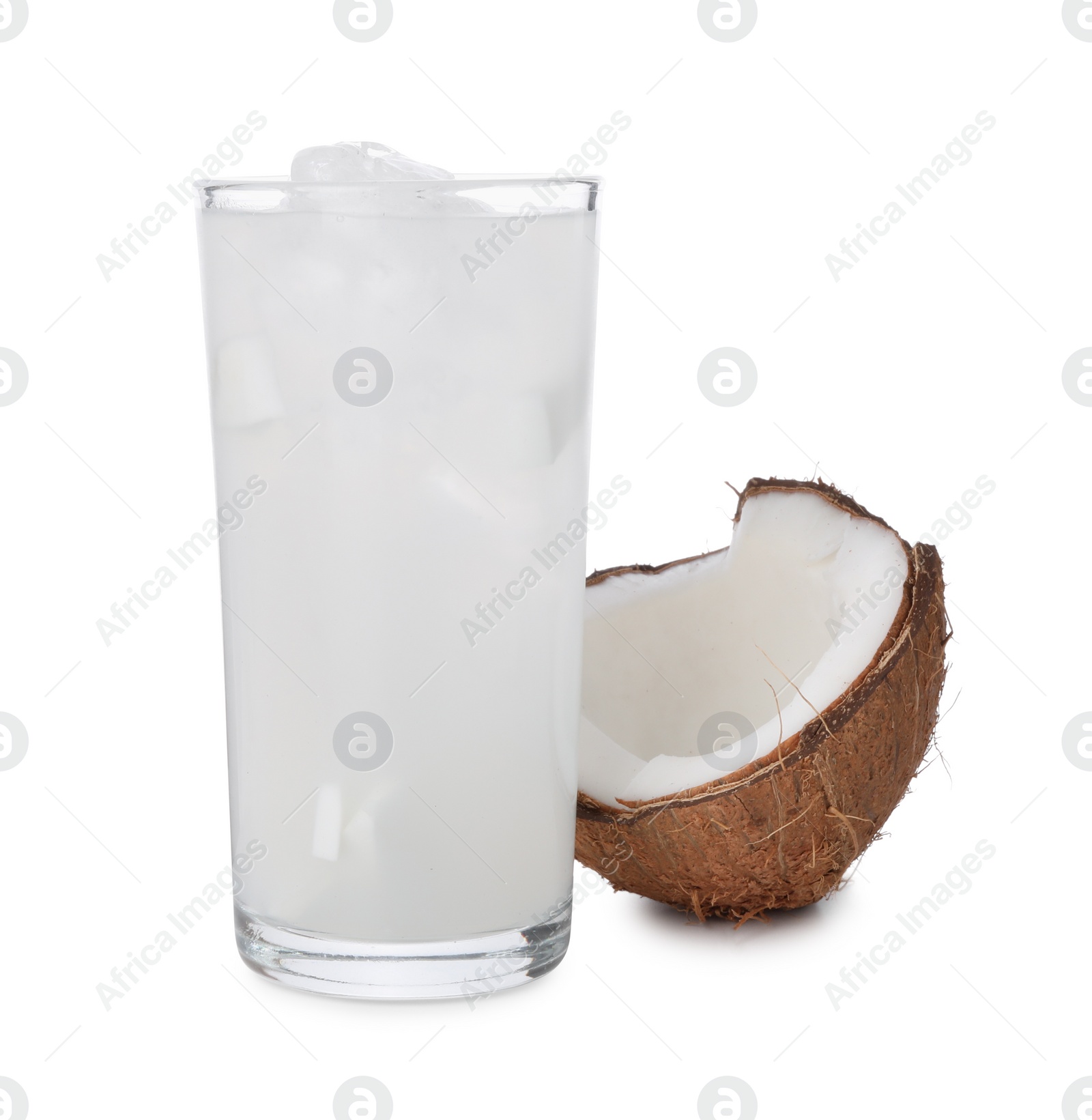 Photo of Glass of coconut water, ice cubes and nut isolated on white