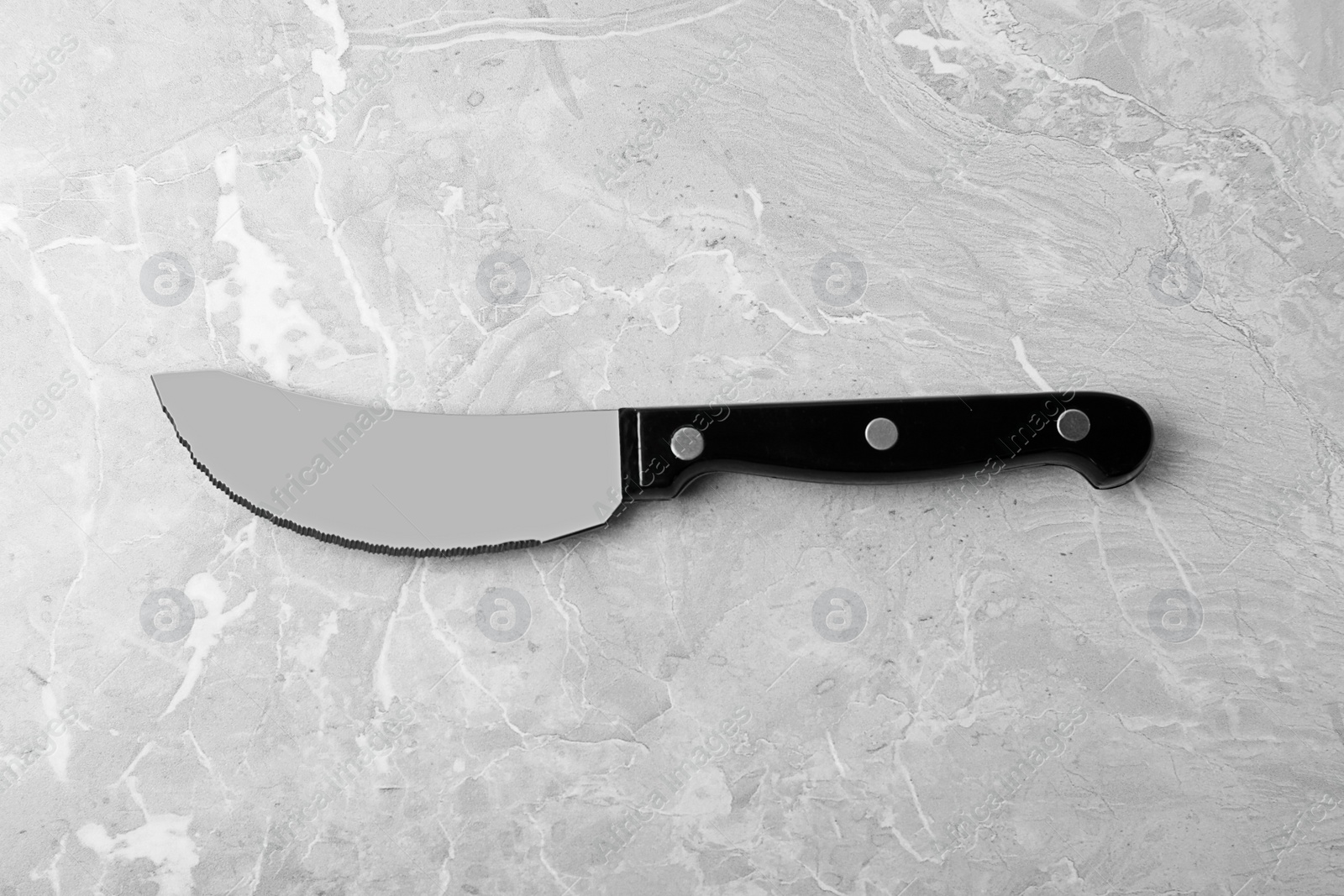 Photo of Sharp pizza knife on grey background, top view