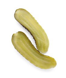 Photo of Halves of tasty pickled cucumber on white background, top view