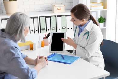 Photo of Female doctor consulting patient in clinic