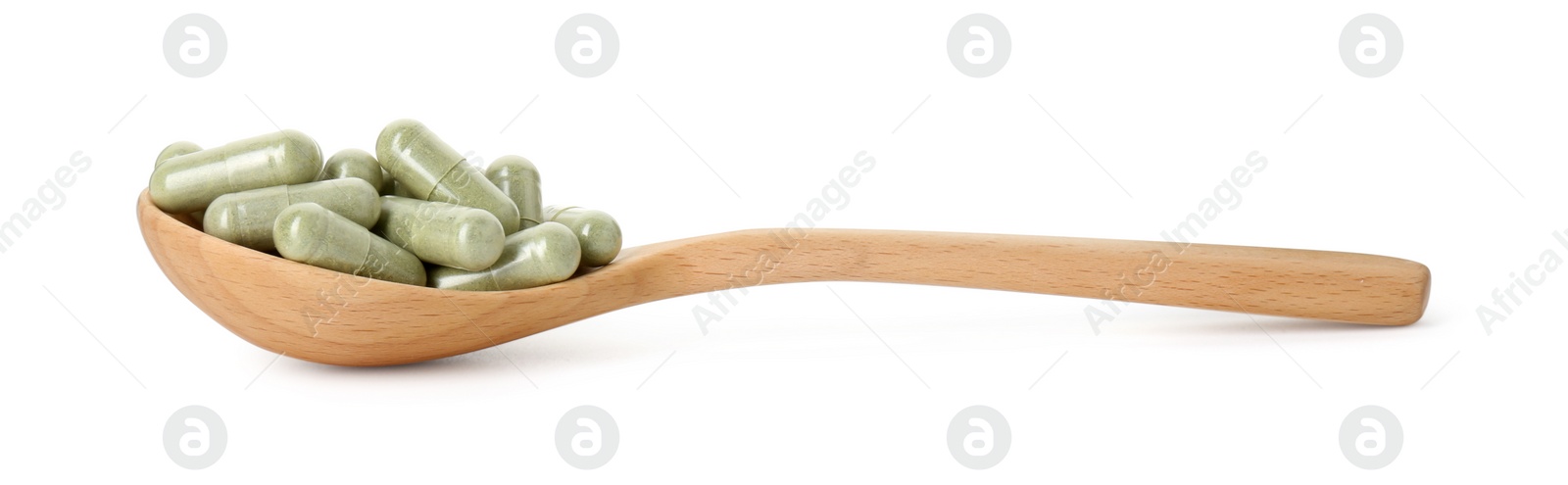 Photo of Vitamin capsules in wooden spoon isolated on white. Health supplement