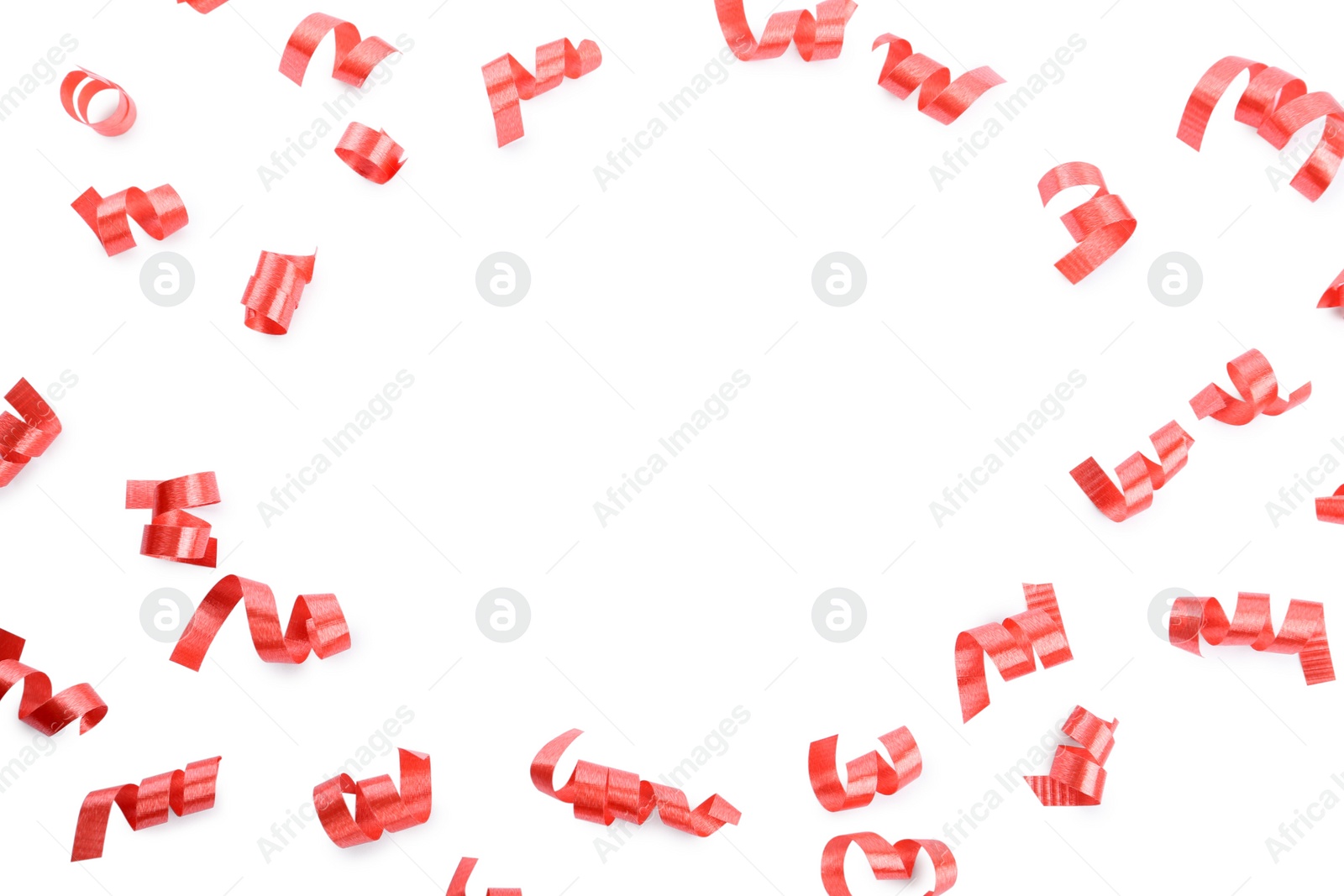 Photo of Frame of red serpentine streamers on white background, top view