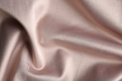 Photo of Texture of delicate pink fabric as background, closeup