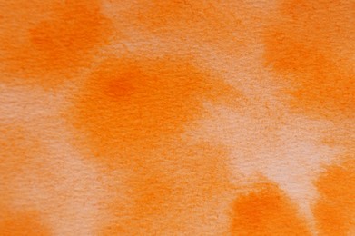Photo of Abstract orange watercolor painting as background, top view