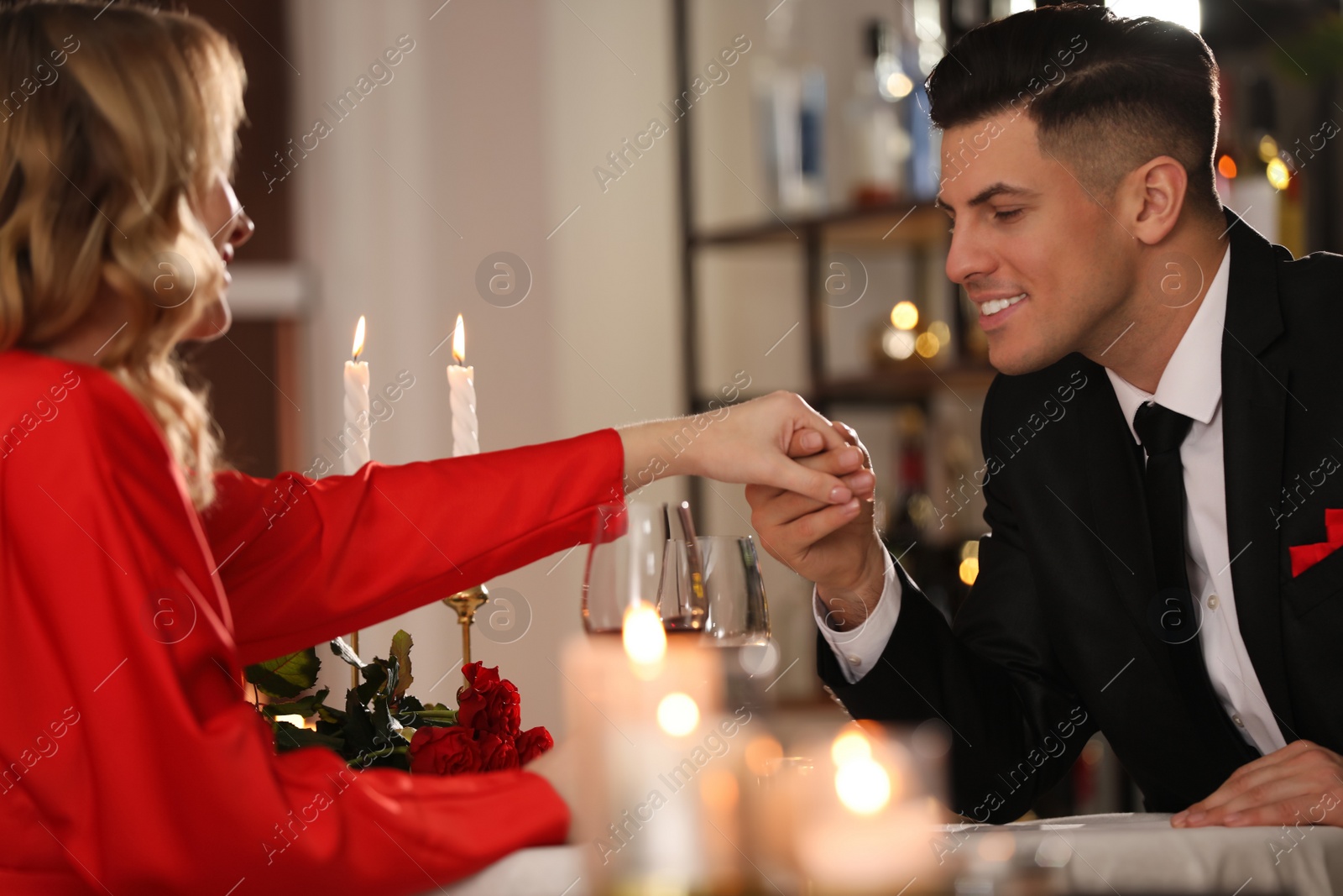 Photo of Lovely couple having romantic dinner on Valentine's day in restaurant