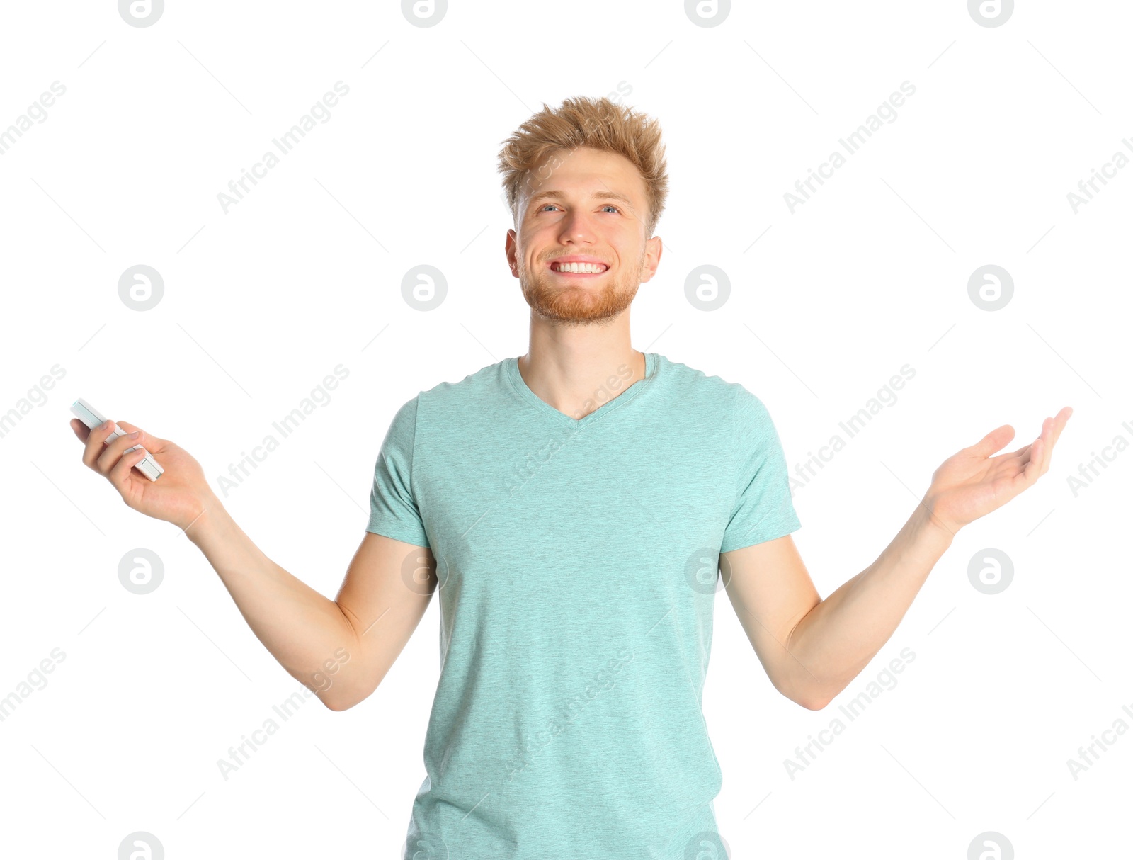 Photo of Young man with air conditioner remote on white background