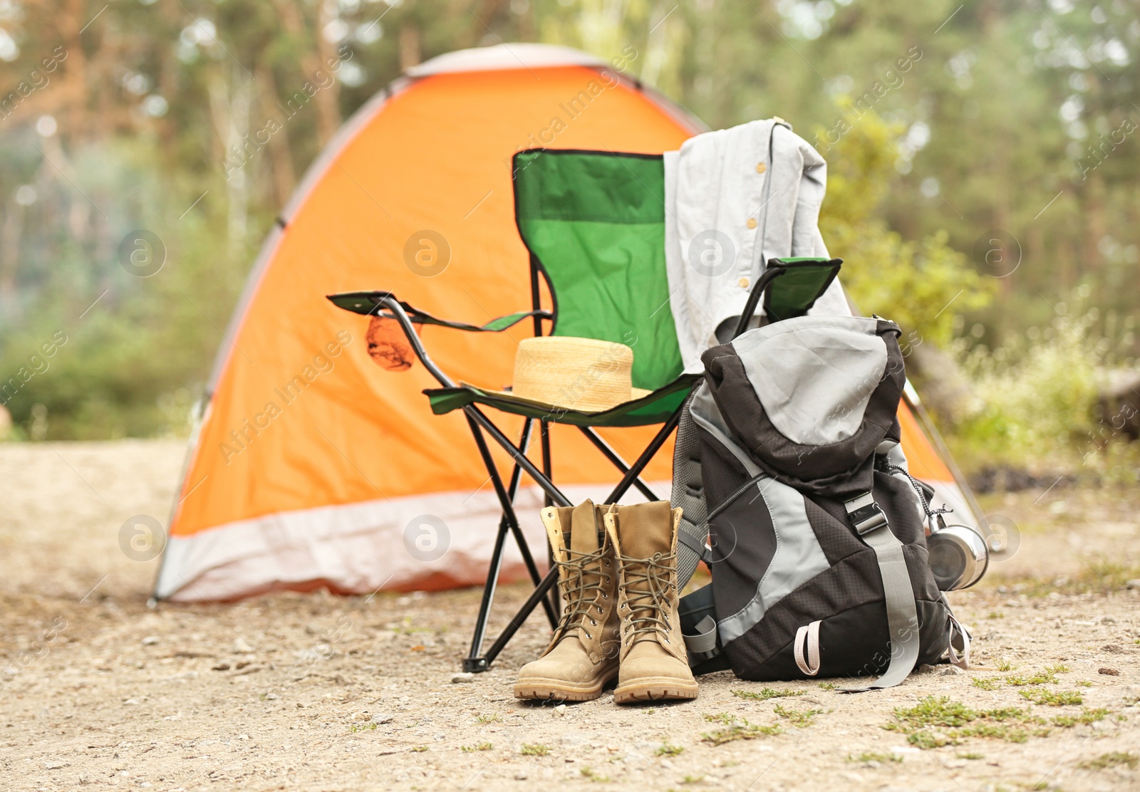 Photo of Set of camping equipment outdoors on summer day