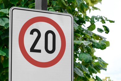 Photo of Post with traffic sign Speed Limit outdoors