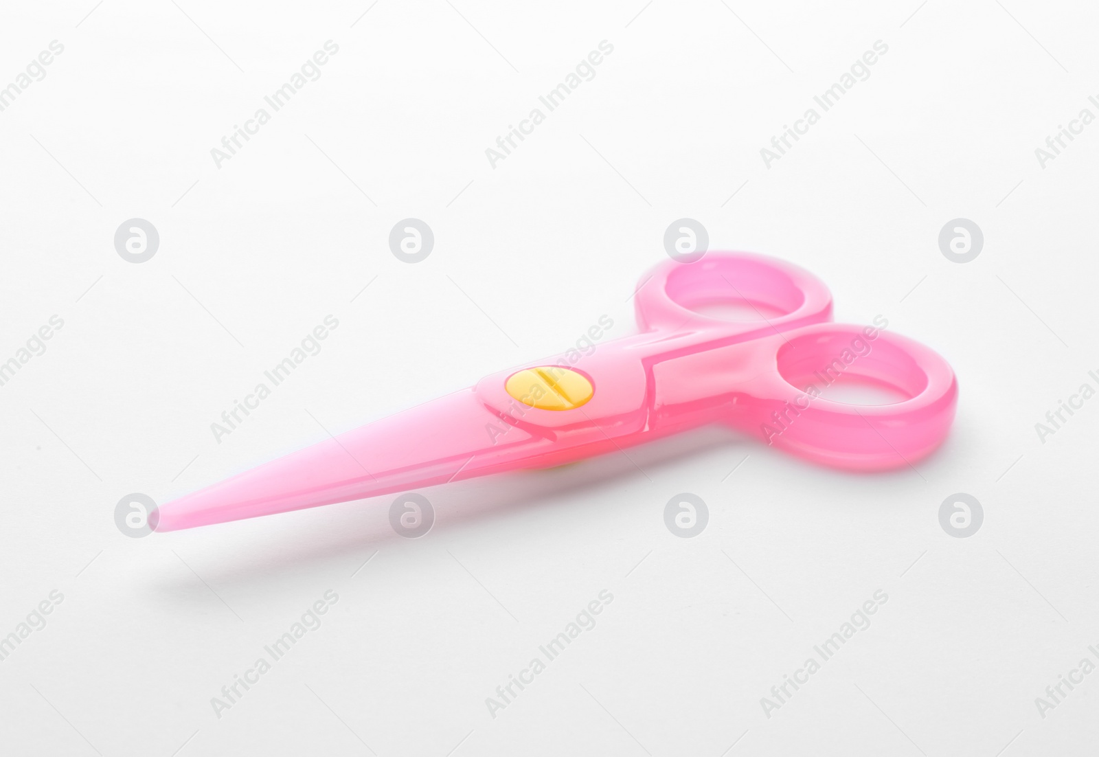 Photo of Colorful plastic scissors on white background. School stationery