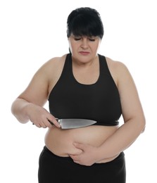 Obese woman with knife on white background. Weight loss surgery