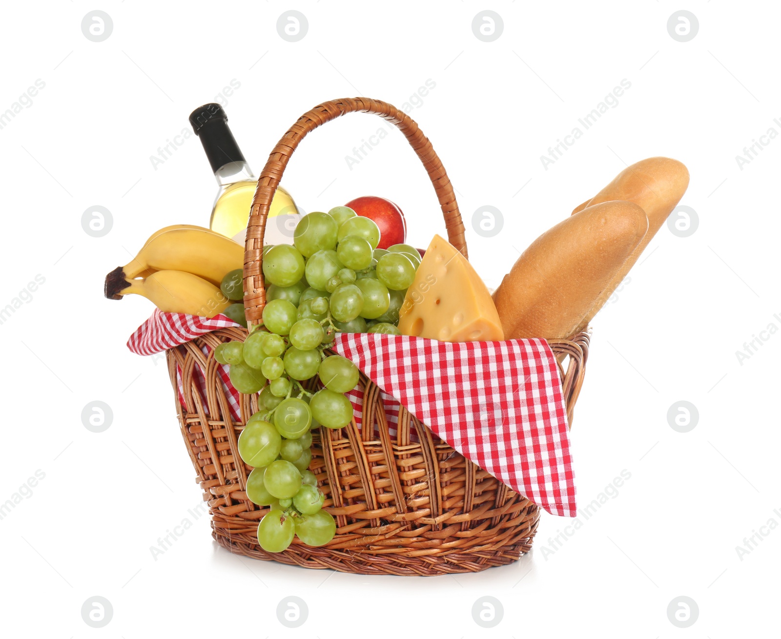 Photo of Wicker basket for picnic filled with food on white background