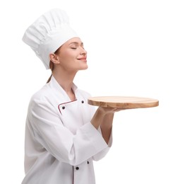 Photo of Happy chef in uniform holding empty wooden board on white background