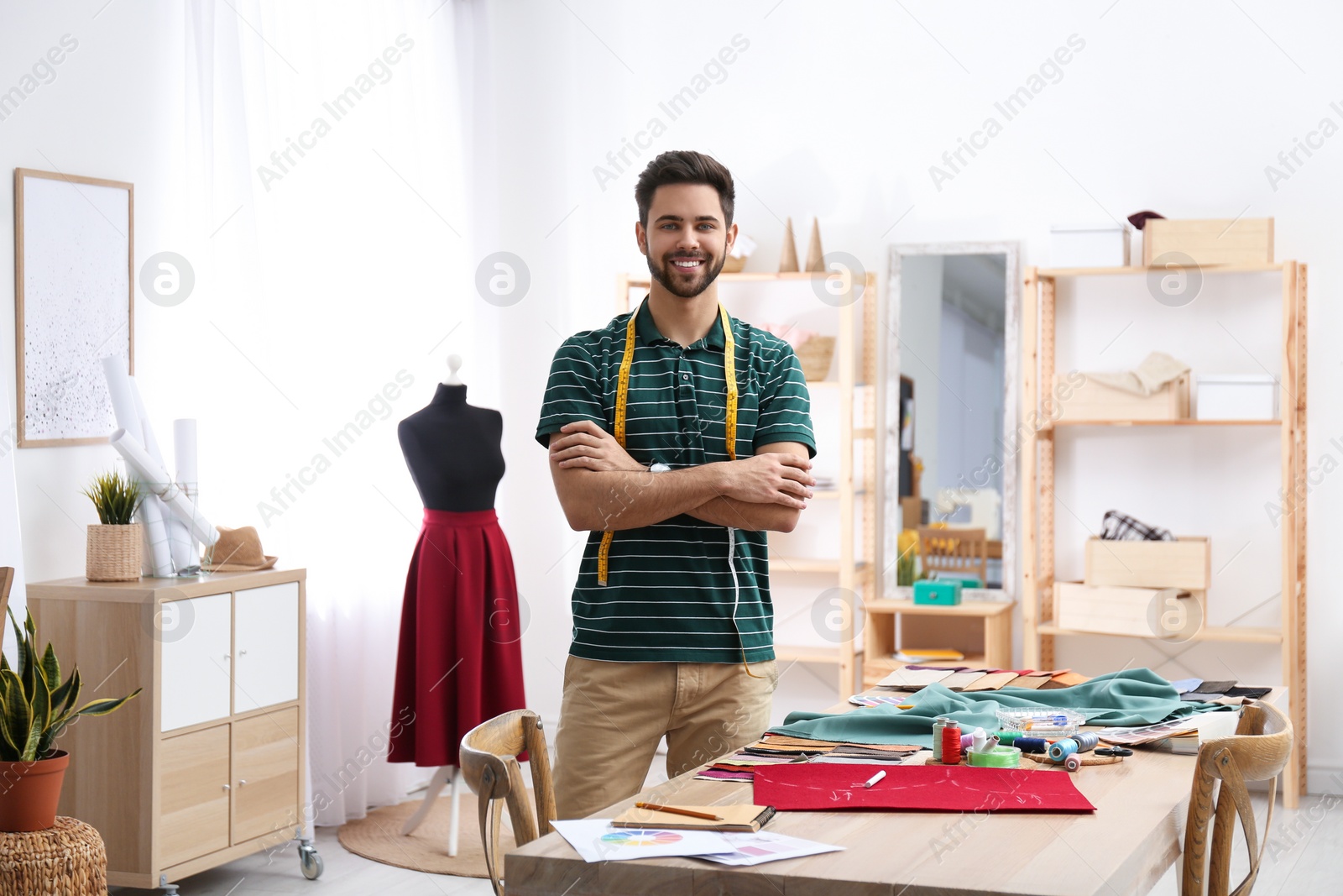 Photo of Fashion designer creating new clothes in studio