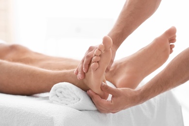 Young woman receiving massage in salon, closeup